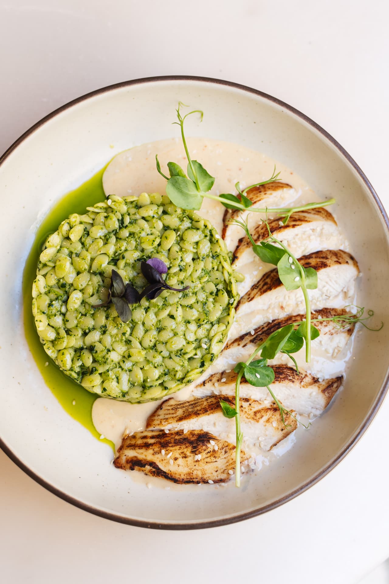 Green bowl with grilled chicken
